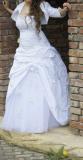 Suknia ślubna Sprzedam białą suknię ślubną kolor: Biel rozmiar: 38